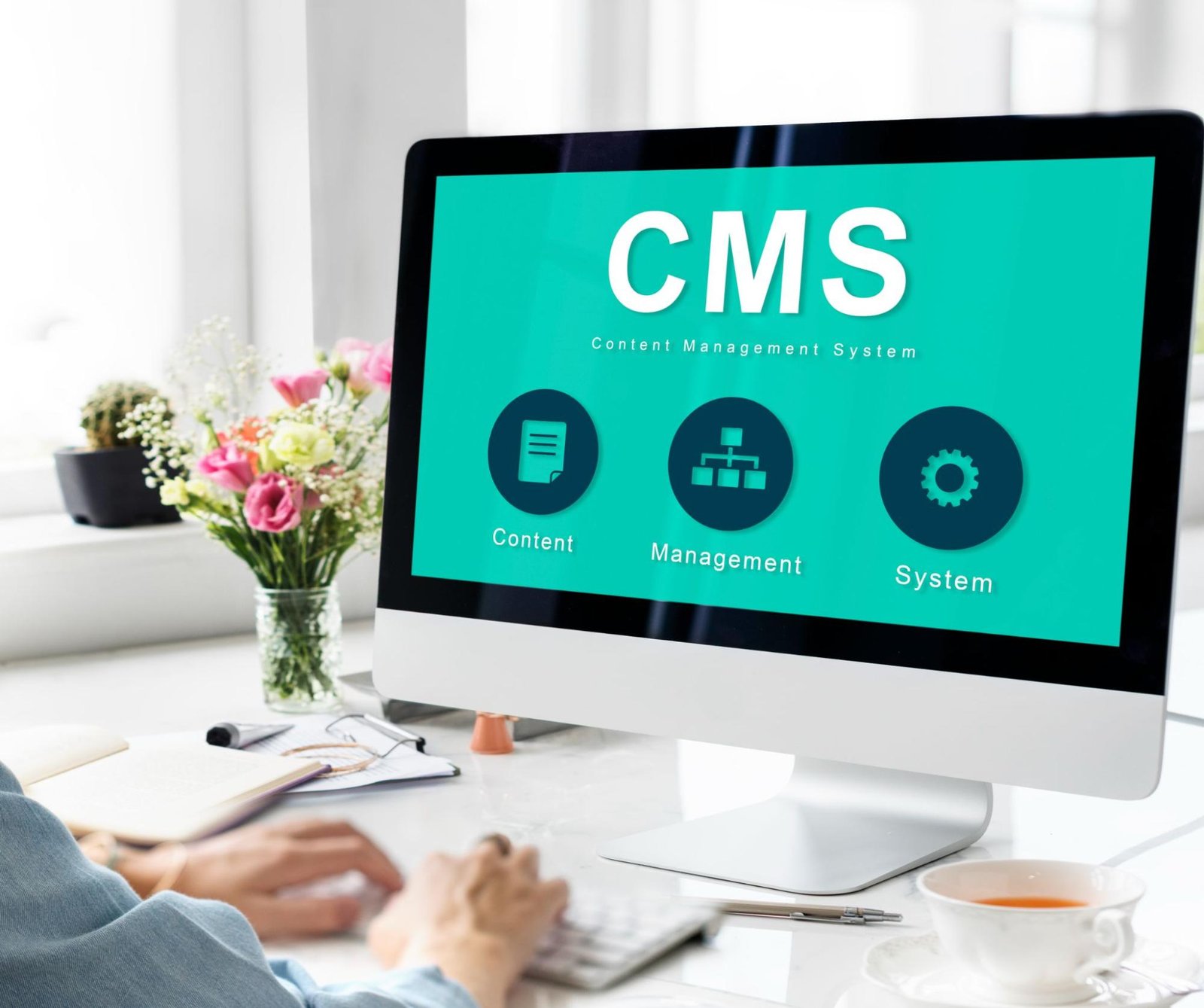 Desktop screen displaying CMS dashboard with content management icons, representing ecommerce platform or CMS selection.