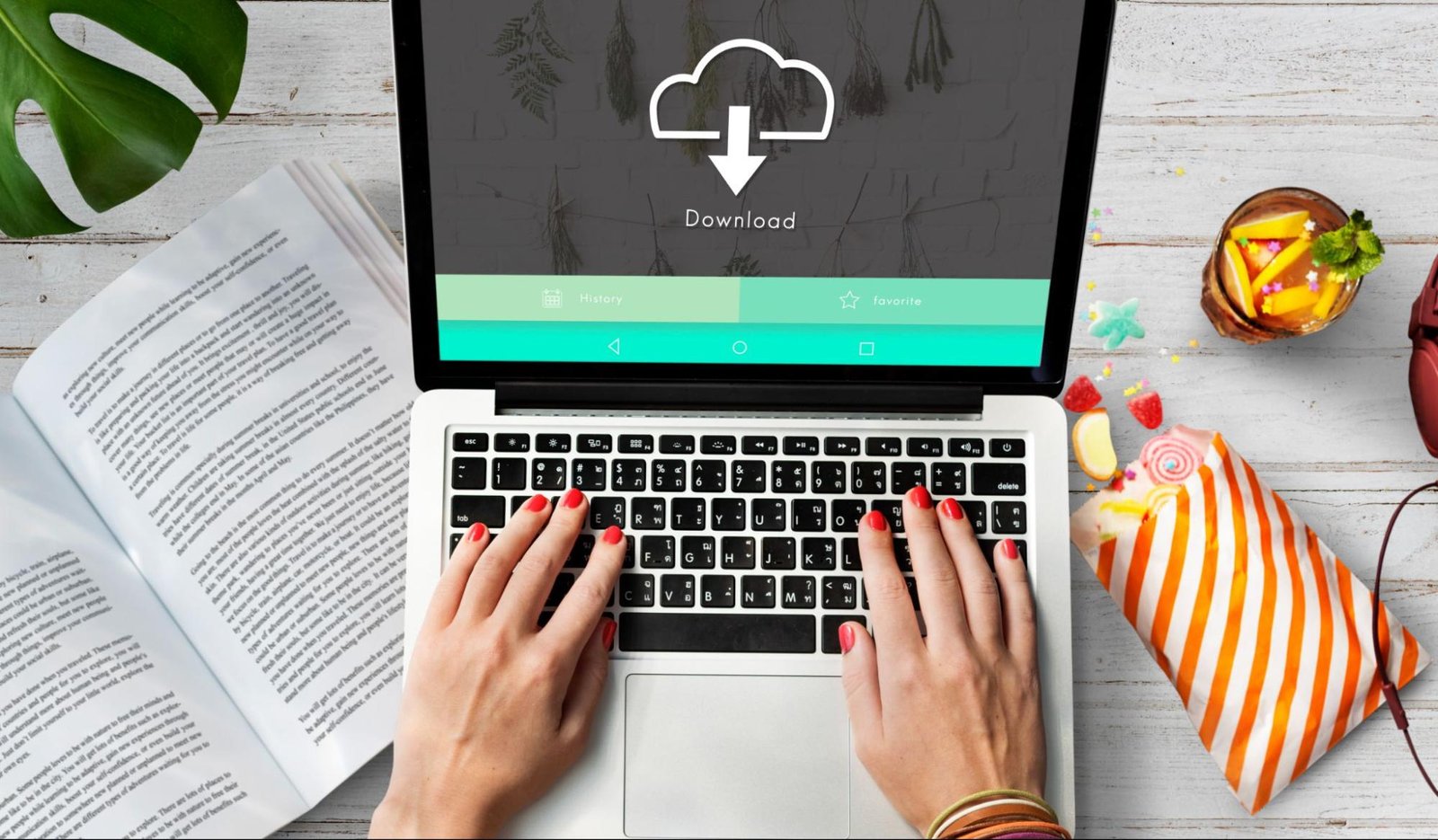 Person working on a laptop with a download screen open highlighting the need to compress manufacturer images for WooCommerce on page SEO.