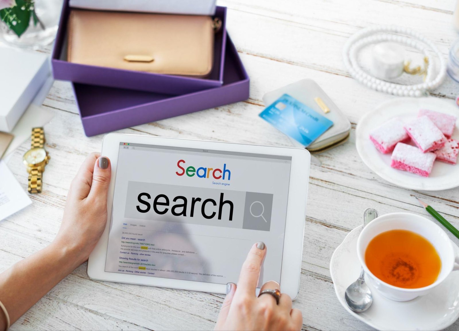 Person using a tablet to search online