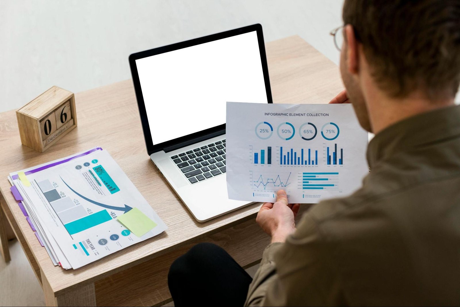 Man reviewing transparent, actionable reporting with data charts and graphs.
