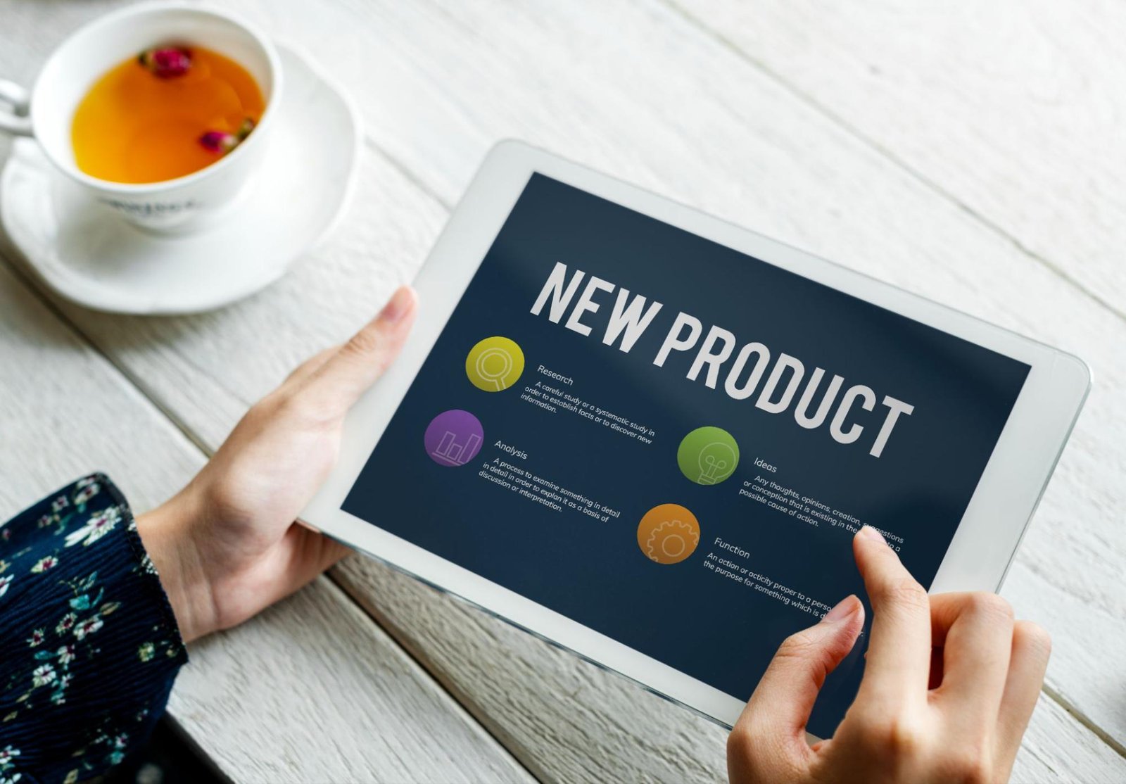 Person viewing a “New Product” page on tablet emphasizing unique word product descriptions for WooCommerce SEO.