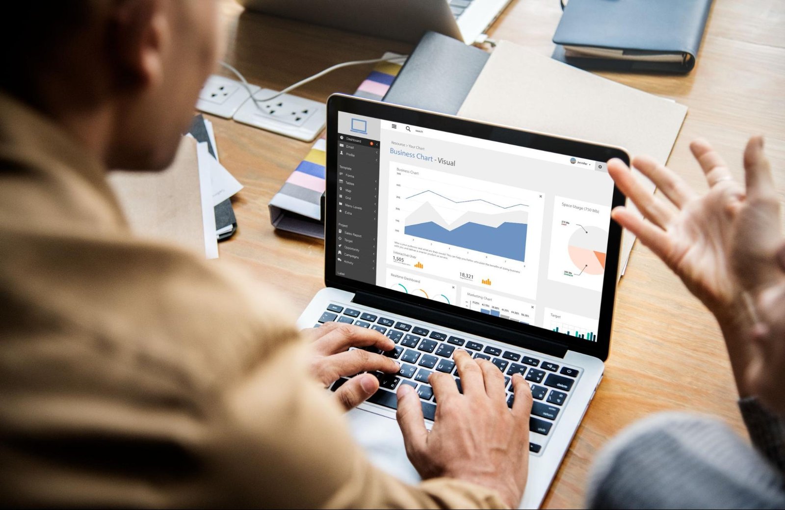 Team analyzing ecommerce performance data on a laptop dashboard.