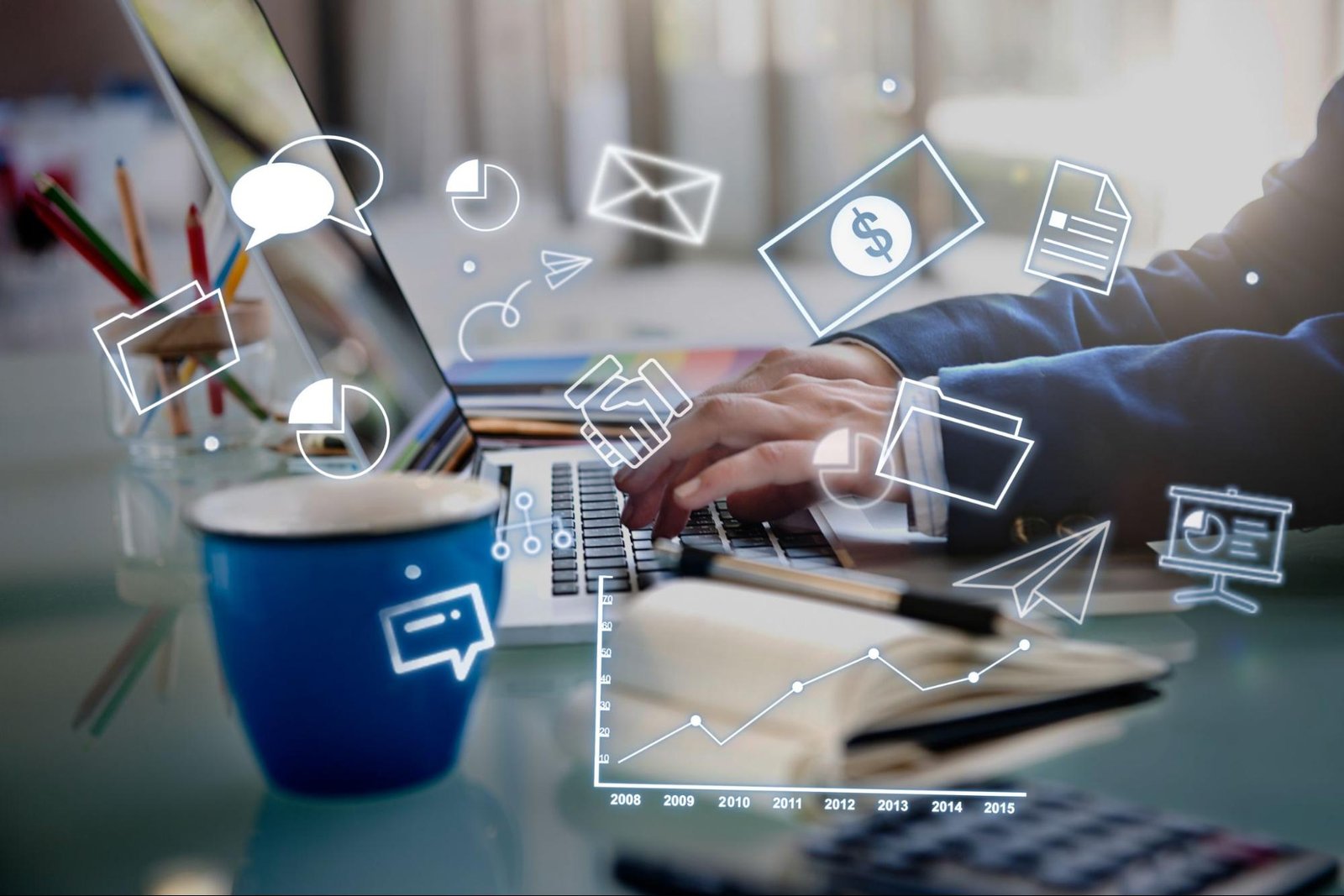 Person typing on laptop with communication and business icons symbolizing cultural fit.